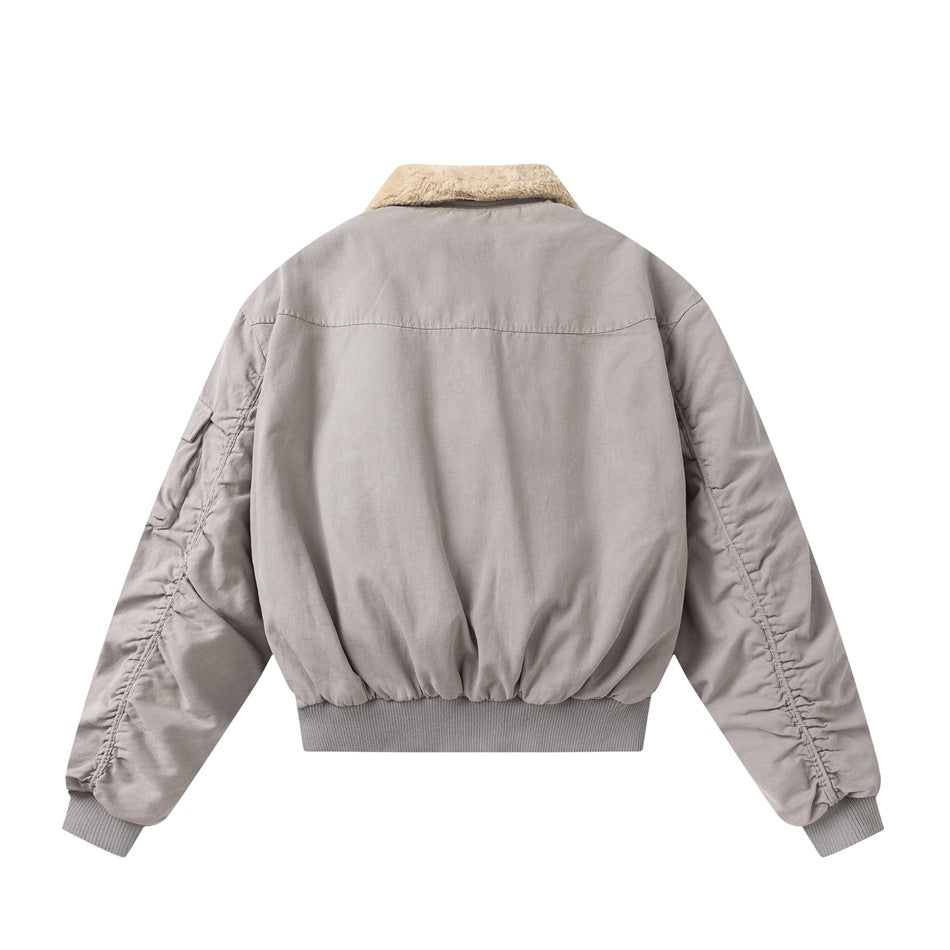 Back view of a light gray bomber jacket with a cream collar and gathered sleeves.