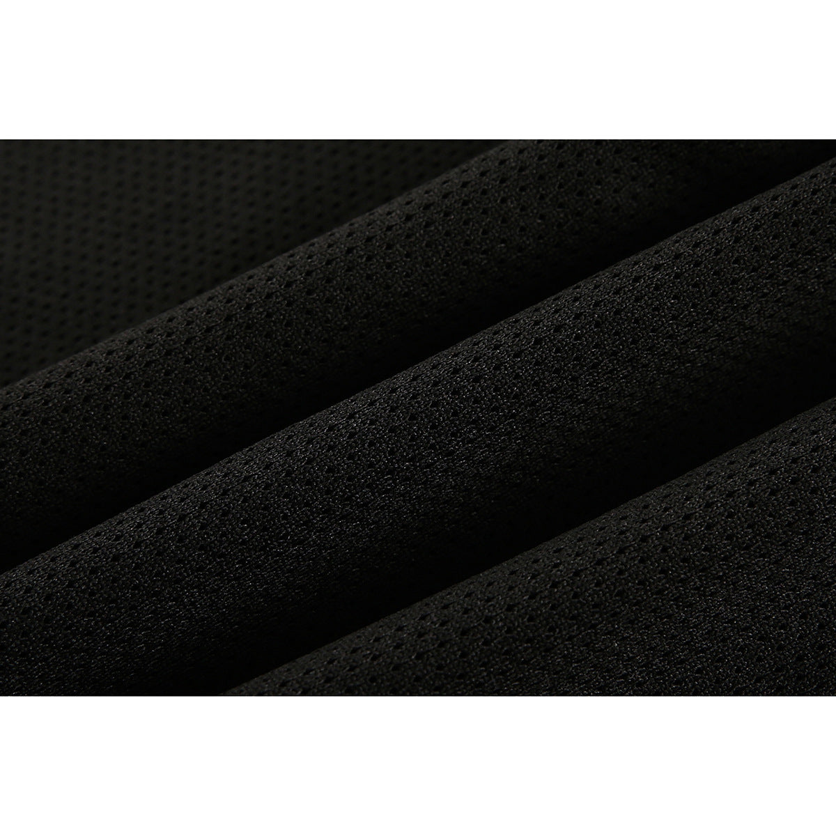Extreme close-up of black fabric showing its textured mesh surface.