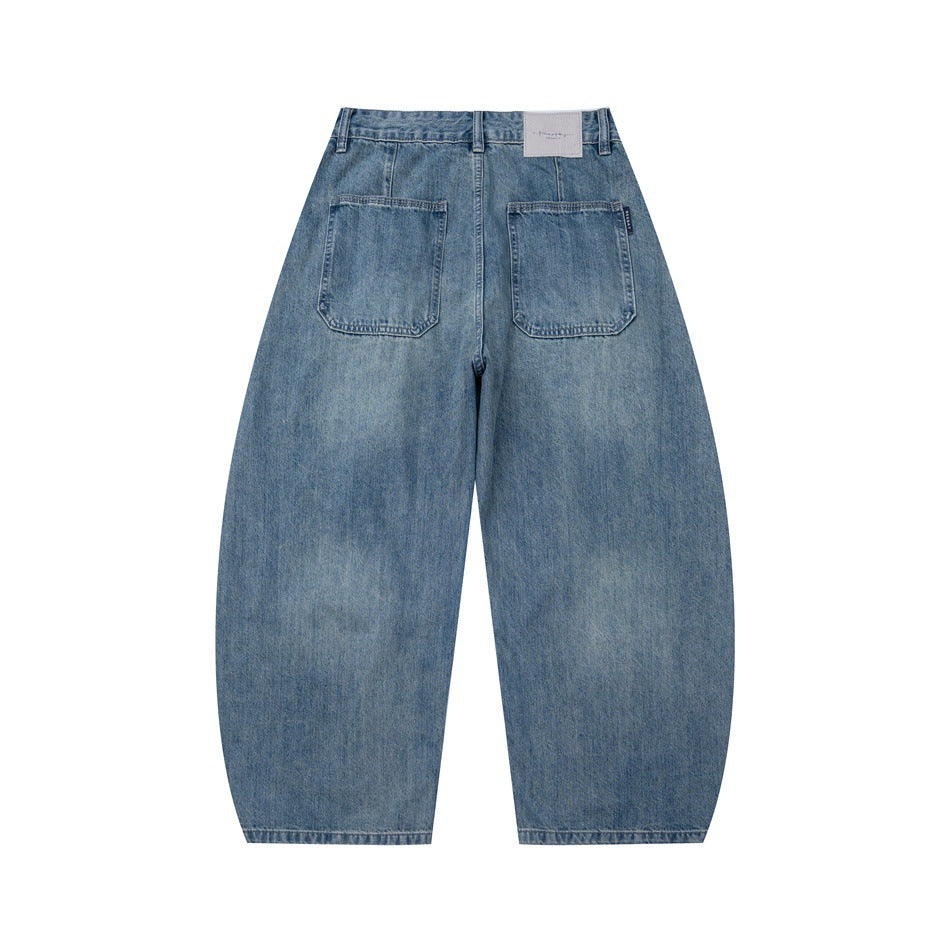 Back view of blue washed wide-leg denim jeans with two patch pockets and a waistband label patch