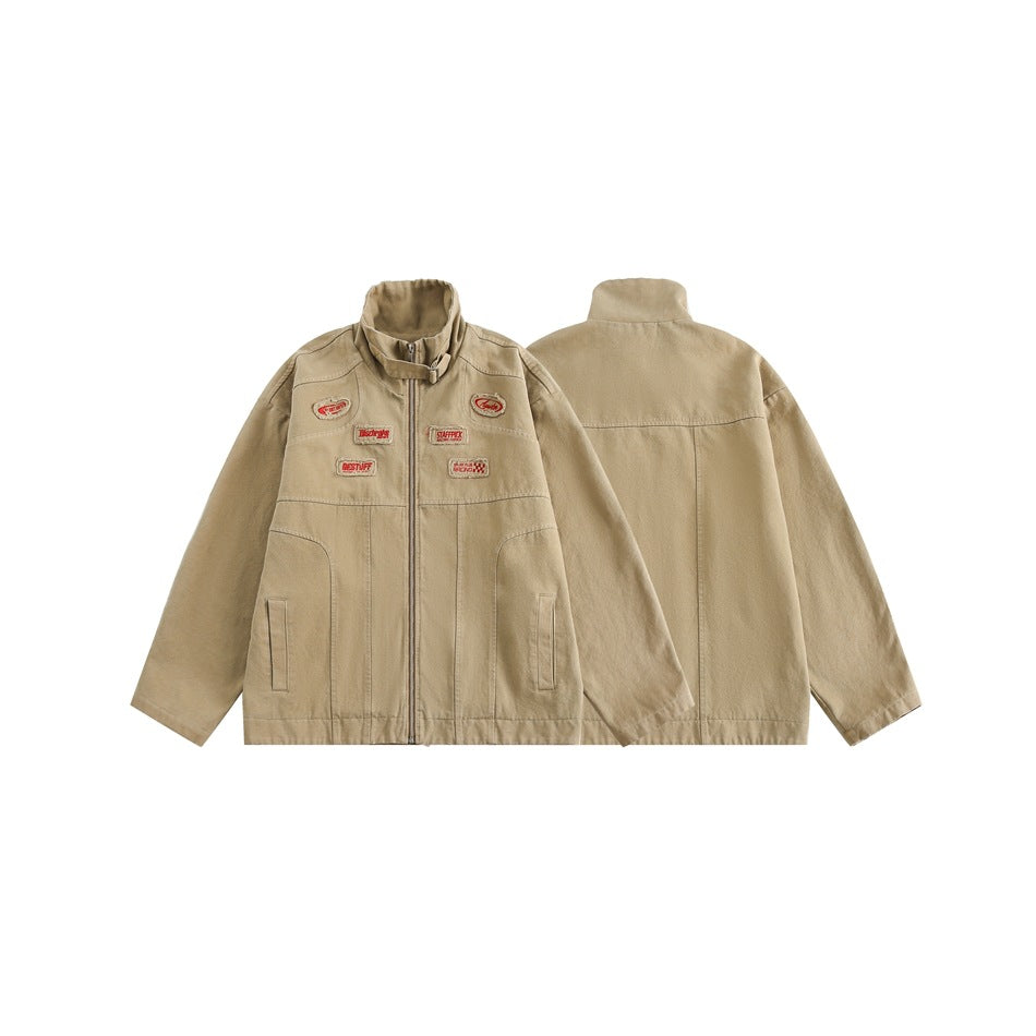 Tan zip jacket shown from the front and back, with a stand collar, pockets, and embroidered patches.