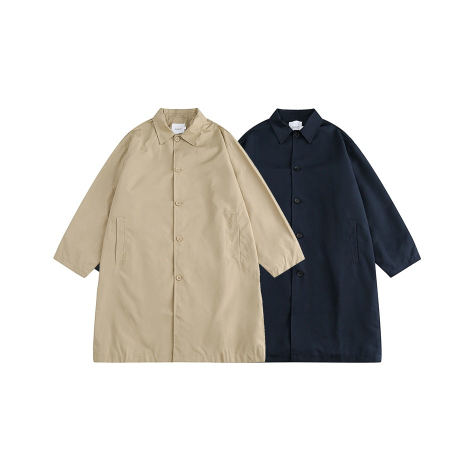Two long button-front coats shown from the front in beige and dark navy.