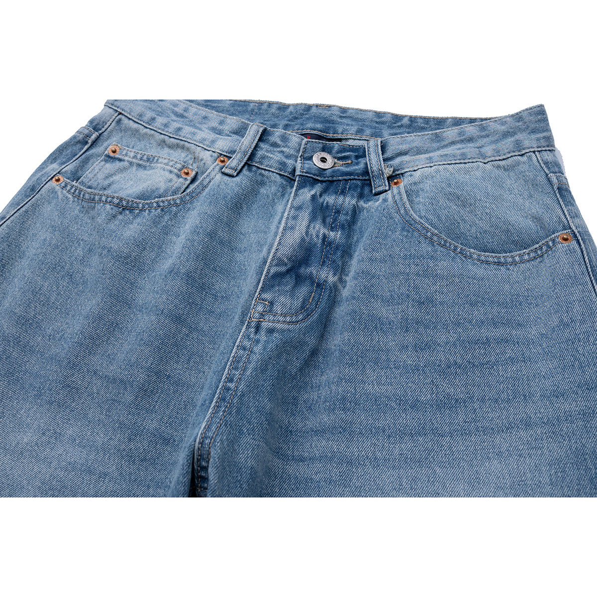 Close-up of light blue jeans showing the front waistband, button, fly, and curved pockets.