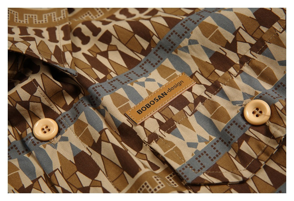 Close-up of the shirt's geometric print, stitching, tan buttons and sewn BOOSAN design label.