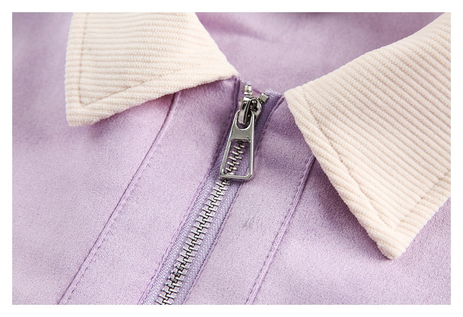 Close-up of the lilac jacket’s metal front zipper and cream ribbed collar.