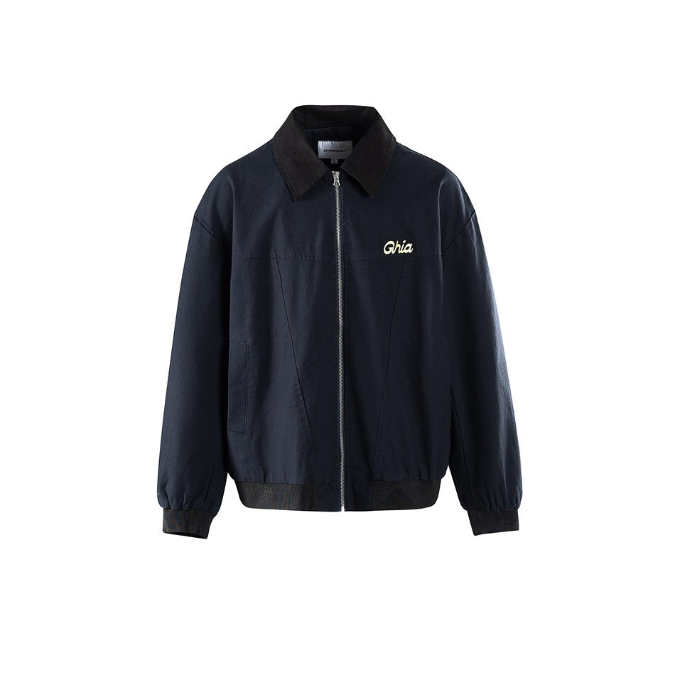 Front view of a navy blue zip-up jacket with dark contrast collar, ribbed hem and cuffs, and a small chest script graphic