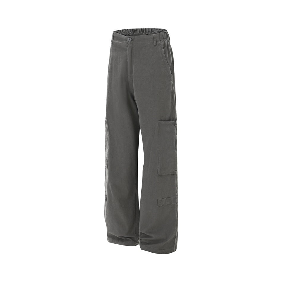 Gray wide-leg cargo pants shown from the front, with an elasticated waistband and large side pockets.