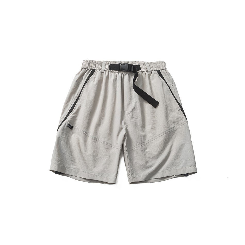 Light gray shorts with elastic waist, black buckle belt strap and black trim on diagonal side pockets, flat front view