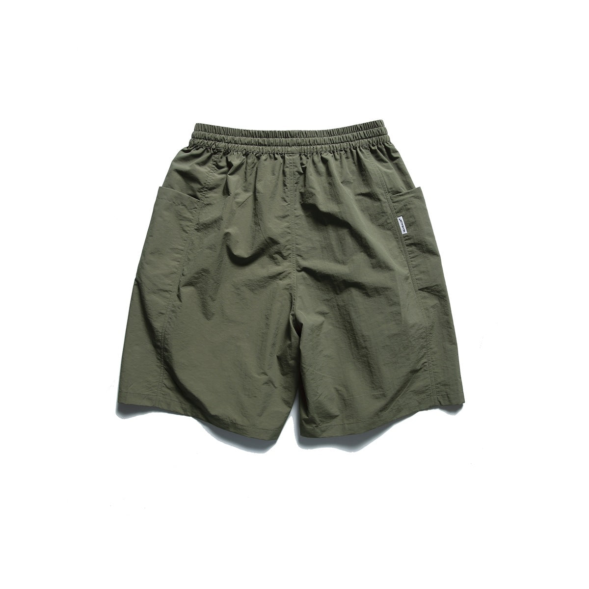 Back view of army green drawstring shorts with elastic waistband and large side patch pockets