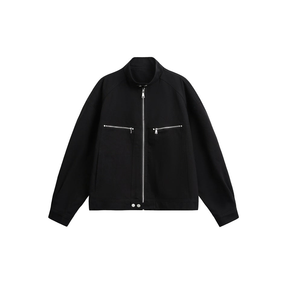 Black stand-collar zip jacket with two zip chest pockets and snap hem tab, front flat lay