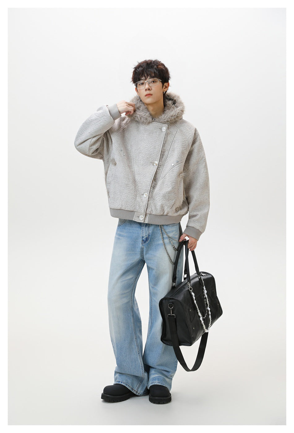 Full-length model wearing a light gray faux-fur-collar jacket with ribbed trim and light blue jeans.