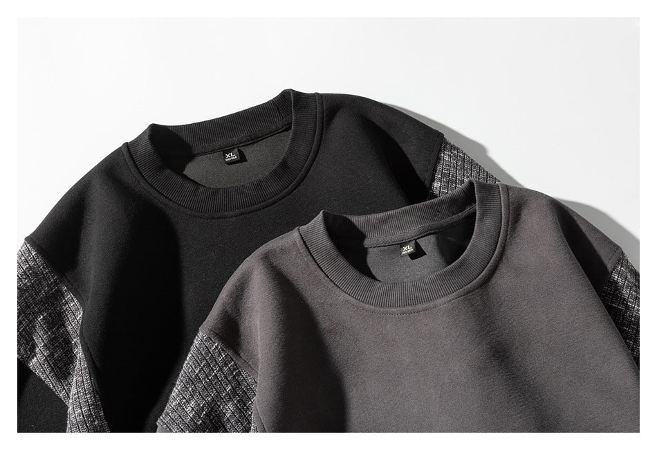 Black and charcoal crewneck sweatshirts shown together, each with a contrasting gray marled knit shoulder and sleeve panel.