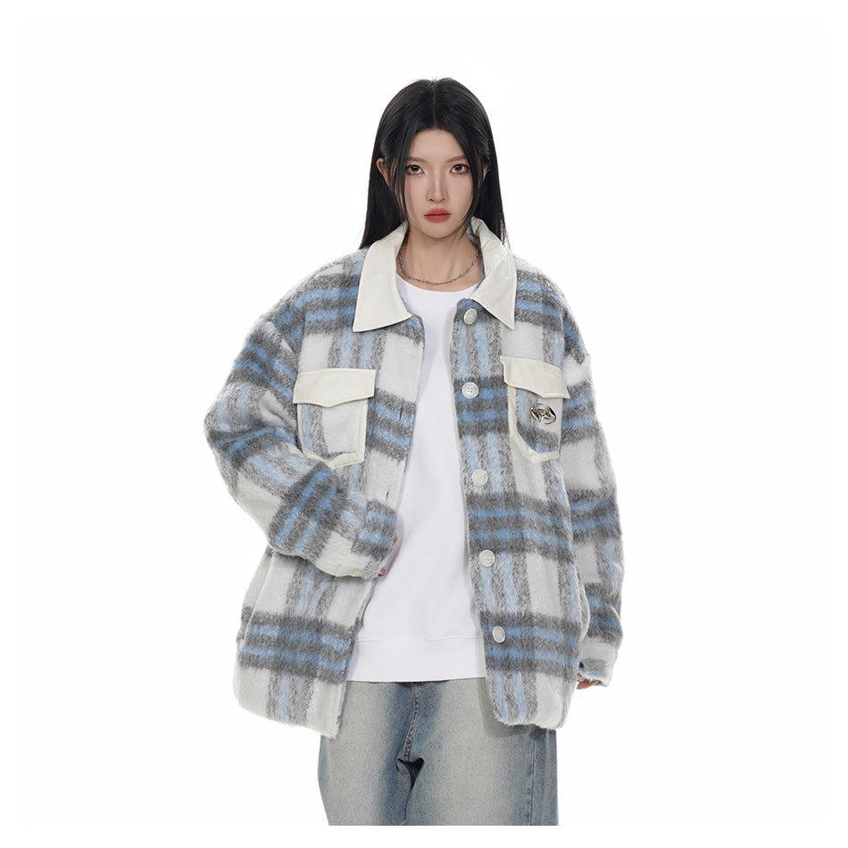 Model wearing a blue and gray plaid button-front jacket with off-white collar over a white top and light jeans