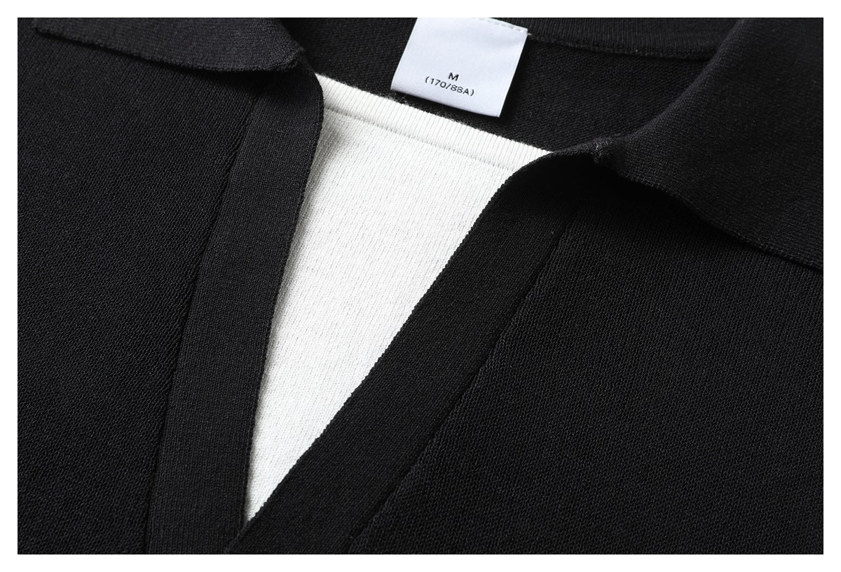 Close-up of the black polo's open collar and white inner panel, with a neck label marked M (170/88A).