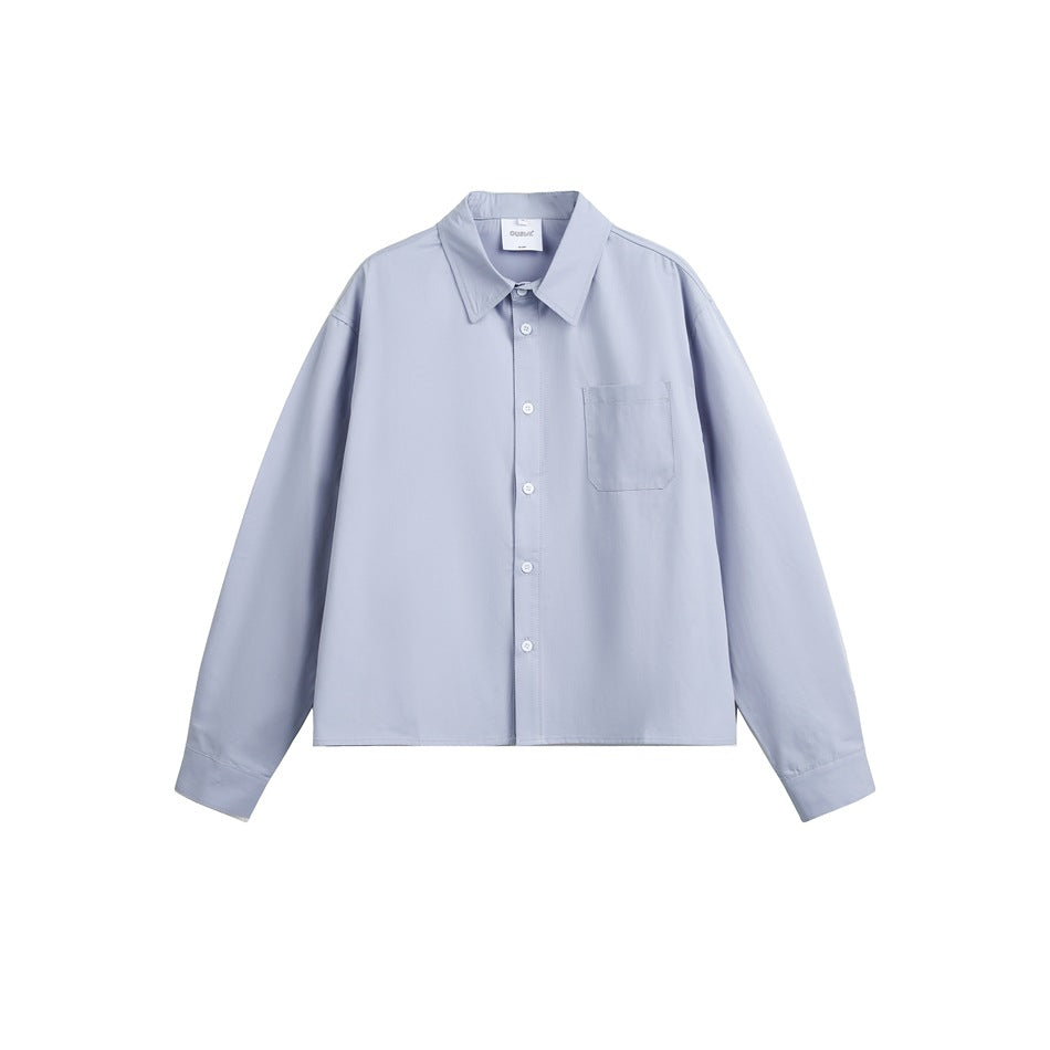 Light blue long-sleeve button-up cropped shirt with a pointed collar and chest pocket, flat front view
