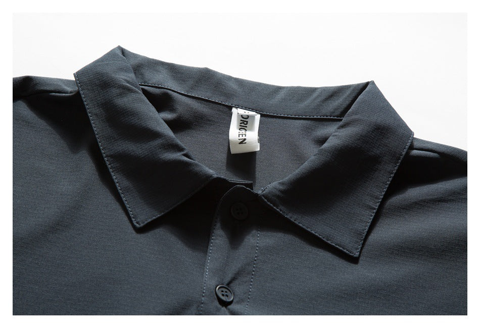 Dark charcoal shirt collar and button placket shown close up, with a sewn-in neck label.