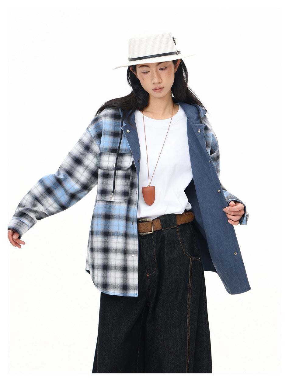 Model showing an open blue-gray plaid hooded shirt with a solid navy inner panel.