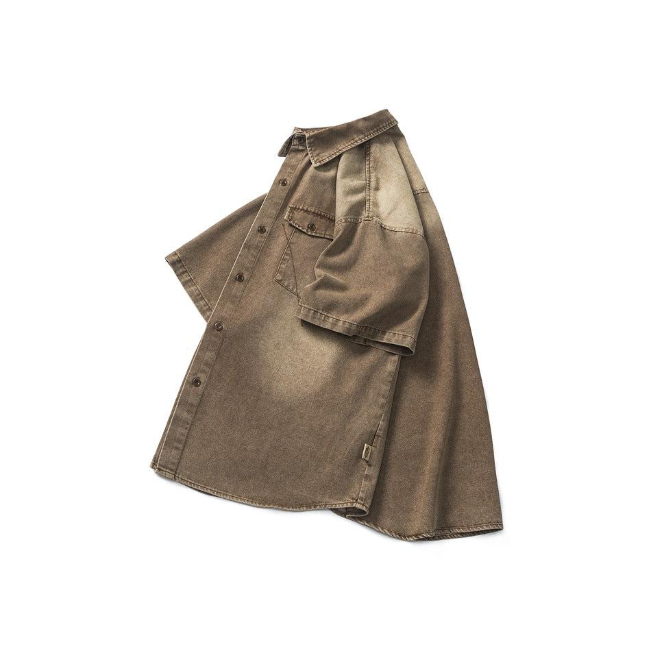 Brown washed short-sleeve button-up shirt shown from the front, with a pointed collar and chest pocket.
