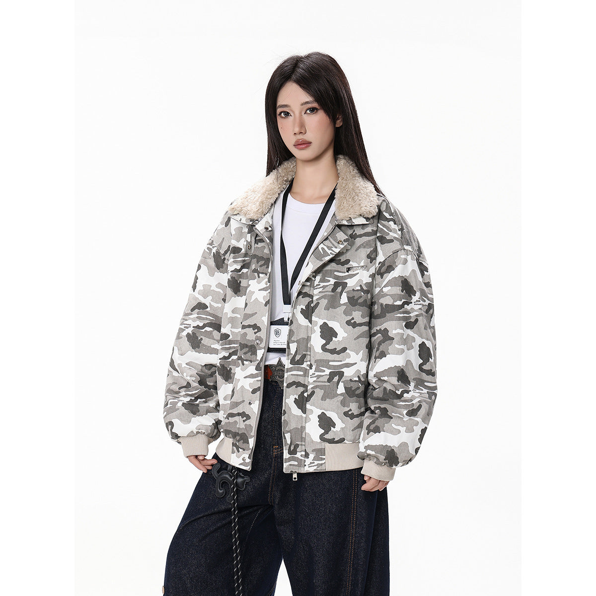 Model wearing an oversized gray-and-white camouflage jacket with a cream fleece collar, ribbed cuffs and hem, and front