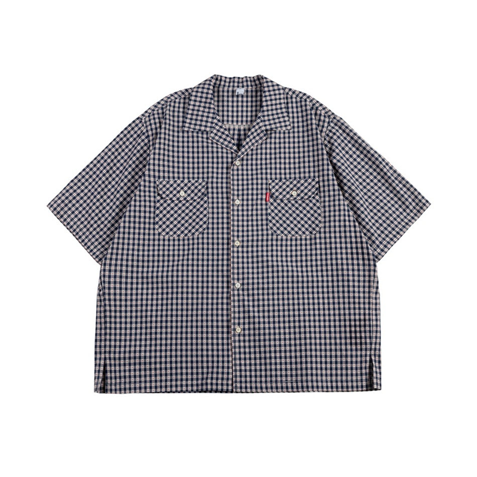 Navy small-check short-sleeve camp collar shirt with two flap chest pockets, flat front view