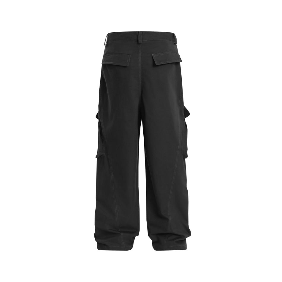 Back view of black wide-leg cargo trousers with flap rear pockets and side cargo pockets.