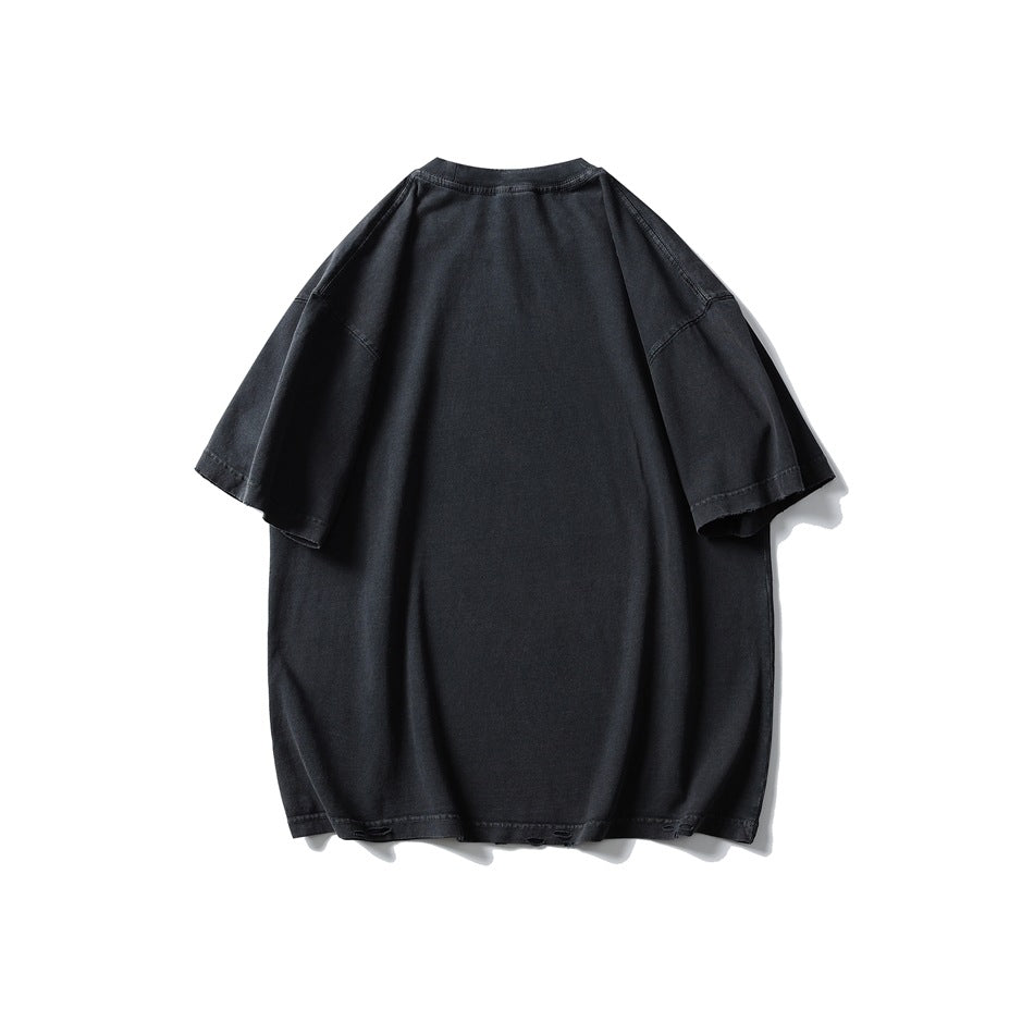 Back view of an oversized charcoal-black T-shirt with short sleeves and a plain design.