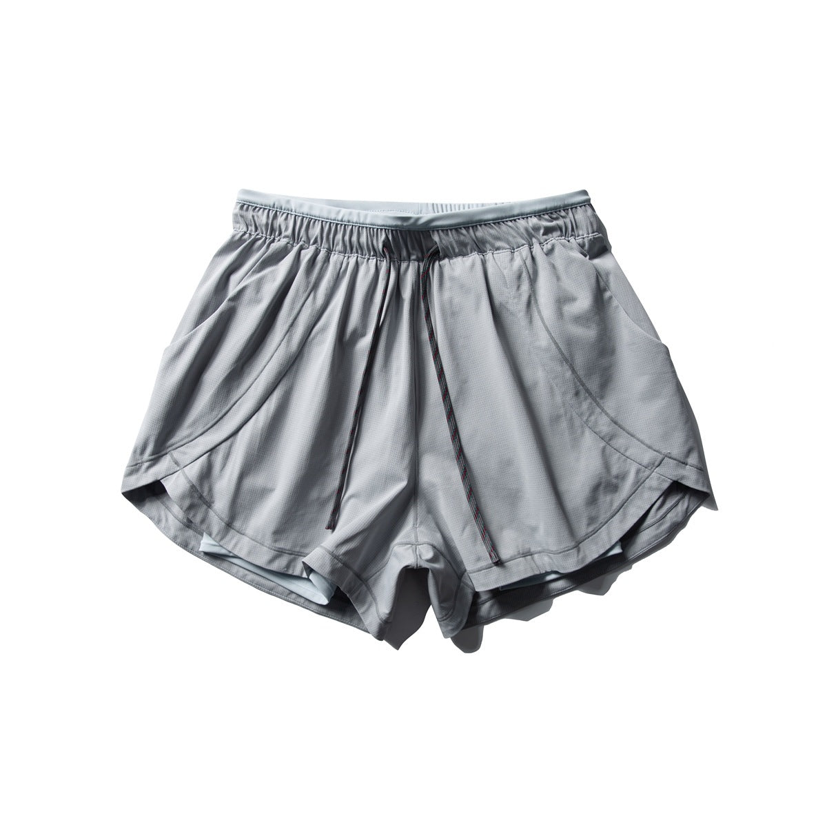 Light gray athletic shorts with drawcord, side pockets and curved hem, laid flat, front view