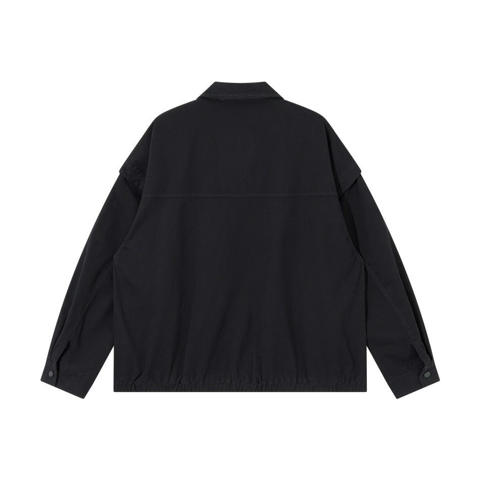 Back view of a black jacket with a yoke seam, long sleeves, and a gathered hem.