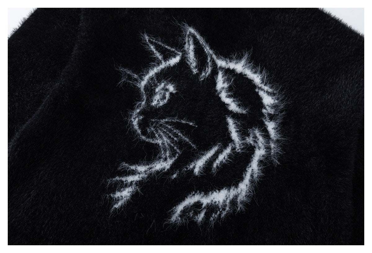 White fuzzy animal-like line-art embroidery on black fabric.