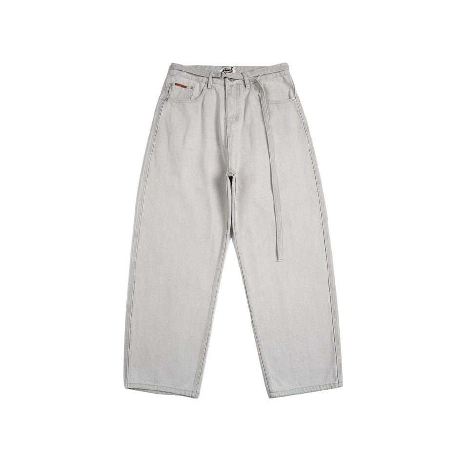 Front view of light gray wide-leg denim jeans with a long tie belt and button fly