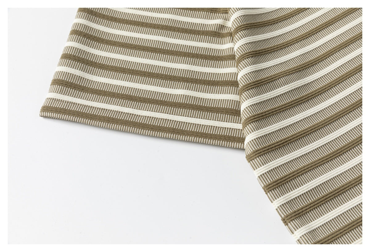 Close-up of the cream-and-taupe striped T-shirt fabric and finished sleeve edge.
