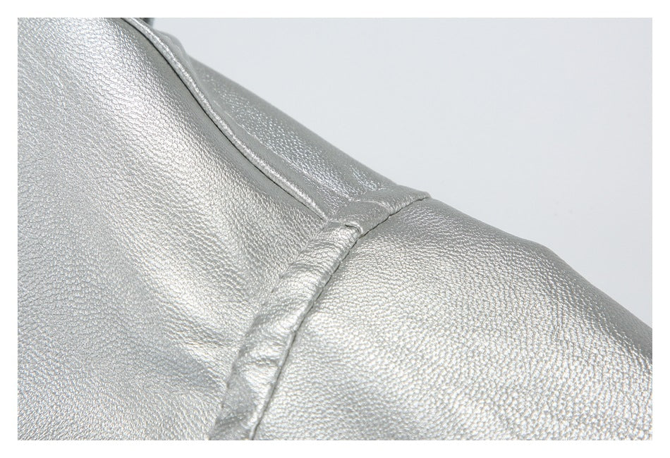 Close-up of the silver jacket's shoulder seam and textured metallic finish.
