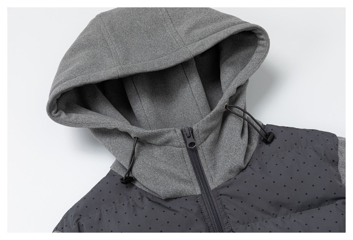 Gray hood and upper jacket close-up, showing black drawcords, a front zipper, and a charcoal dotted panel.