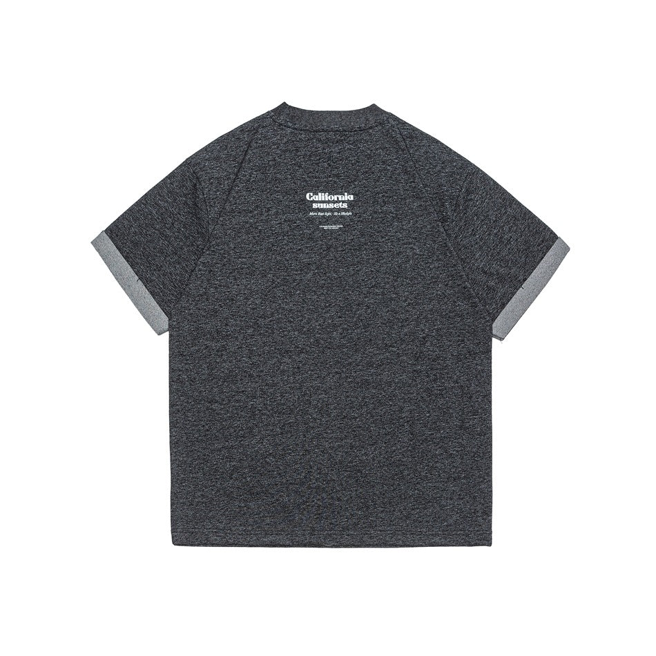 Back view of a charcoal heather T-shirt with a small white upper-back print and light-gray sleeve cuffs.