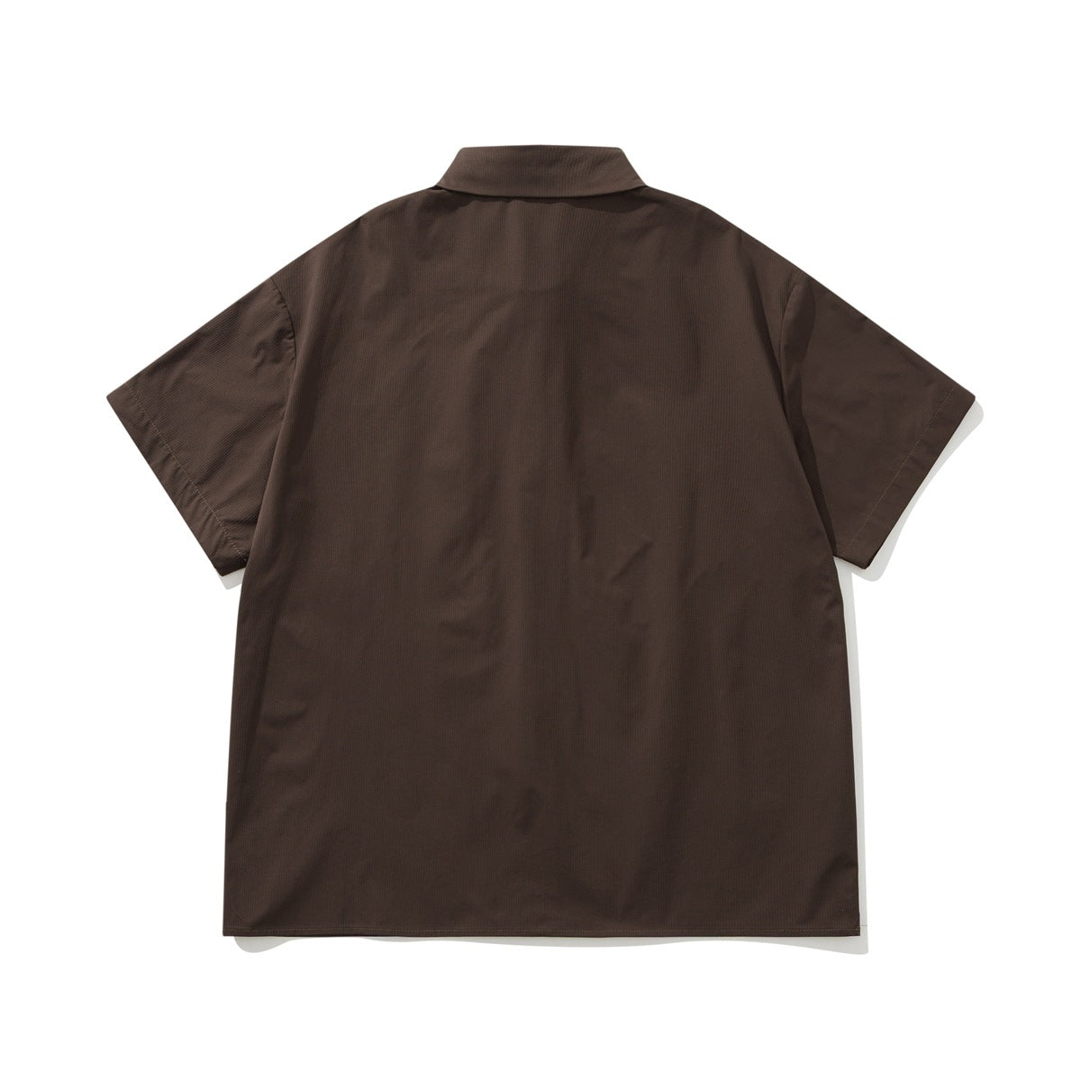 Back view of a dark brown short-sleeve button-up shirt with a collar and plain back.