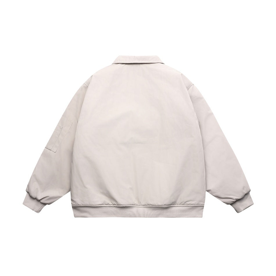 Back view of a pale gray collared jacket with long sleeves and ribbed cuffs and hem.