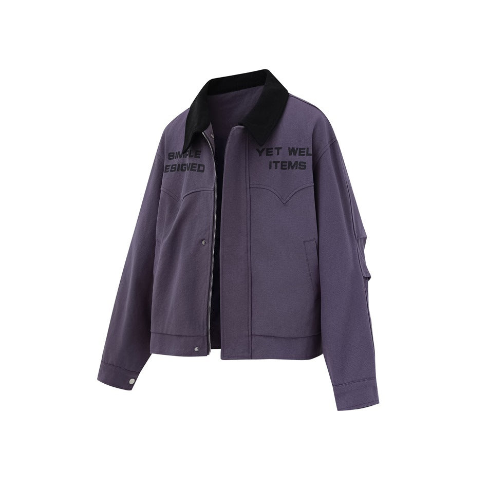 Purple cropped jacket shown at an angle, with a black collar, front zipper and snaps, chest lettering, and pockets.