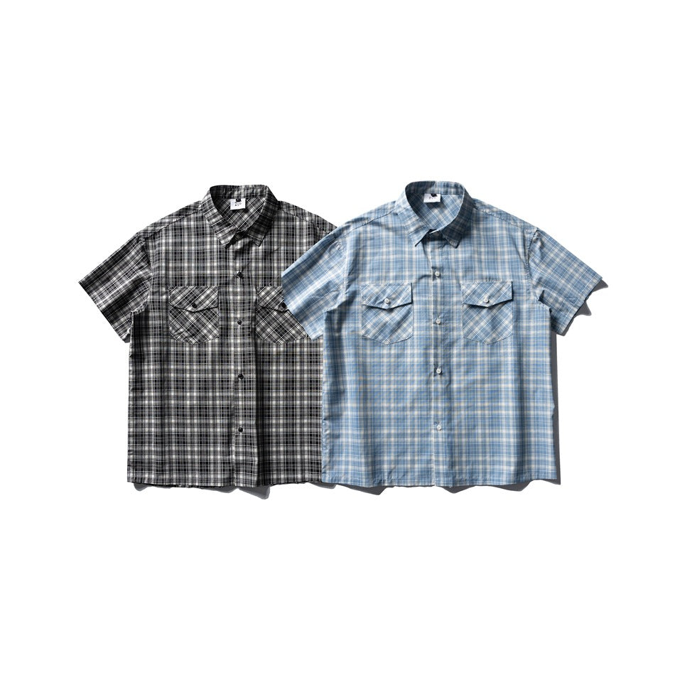 Two short-sleeve plaid button-up shirts shown from the front: one black-and-white and one blue-and-white.