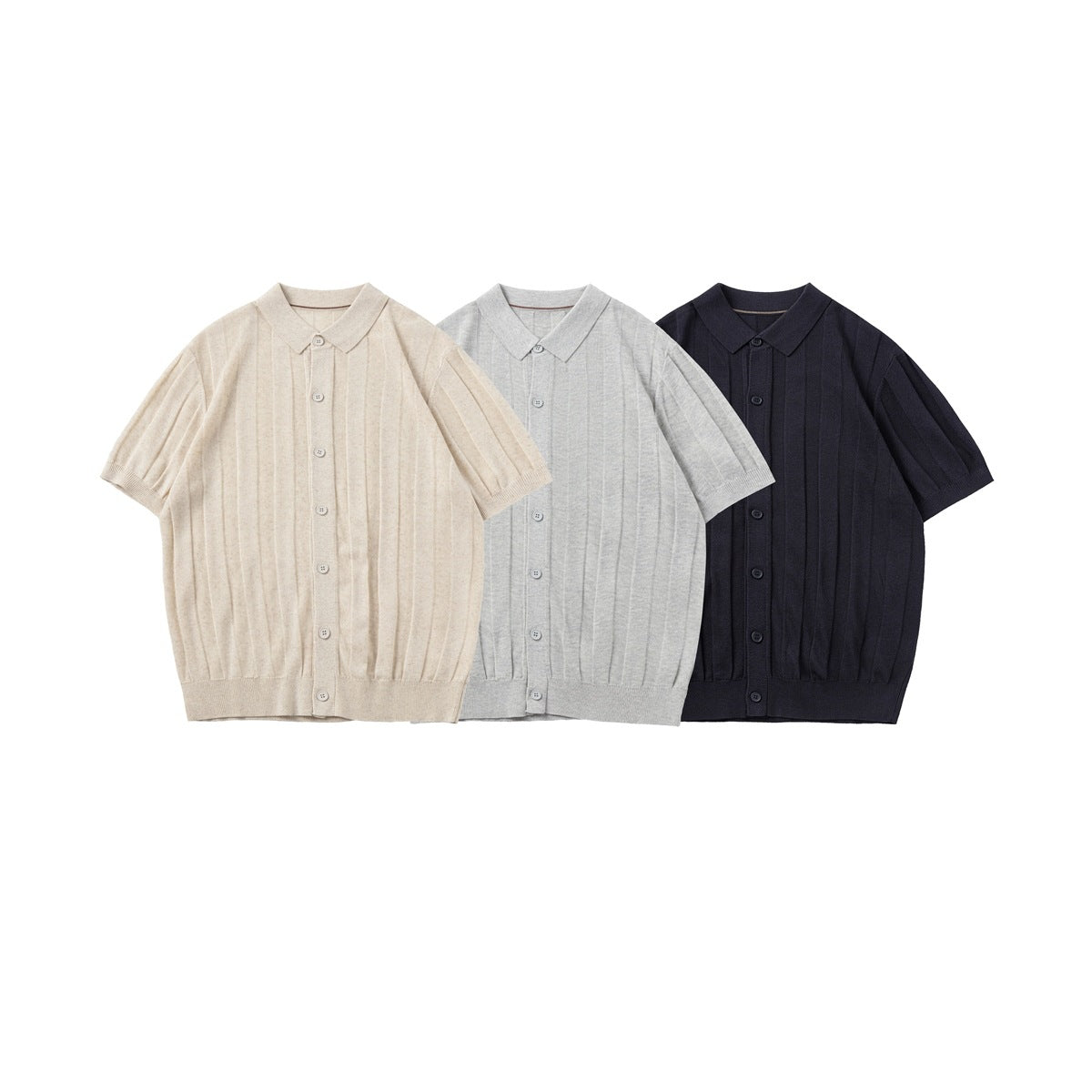 Three short-sleeve collared knit shirts with buttons and vertical ribs in cream, light gray, and navy.