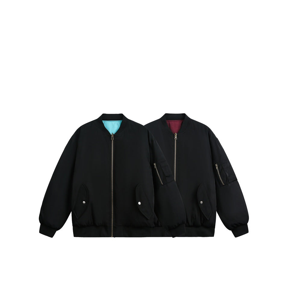 Two black bomber jackets shown together, with turquoise and burgundy lining visible at the collars.