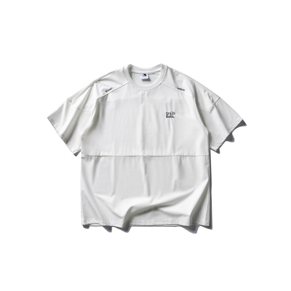 White short-sleeve crew-neck T-shirt flat lay with shoulder zigzag stitching, lower seam and small chest embroidery