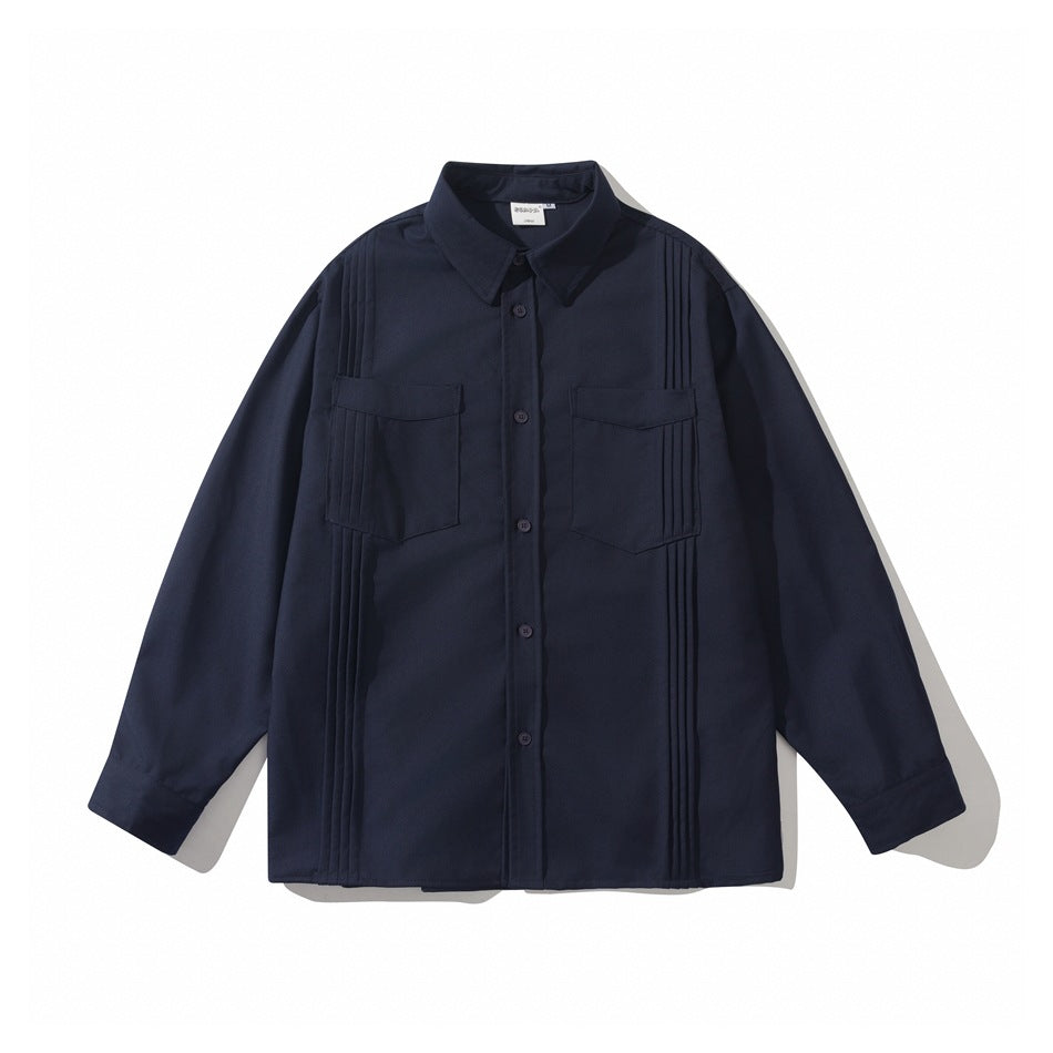 Navy long-sleeve button-front shirt with two flap chest pockets and vertical pintuck pleats, flat lay front view