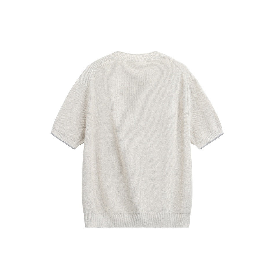 Back view of an ivory short-sleeve knit crewneck laid flat against a white background.