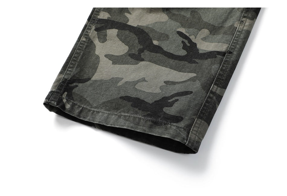 Close-up of the hem of a gray and black camouflage trouser leg.