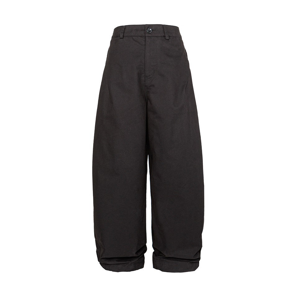 Black wide-leg curved trousers with button closure and folded hems, front view on white background
