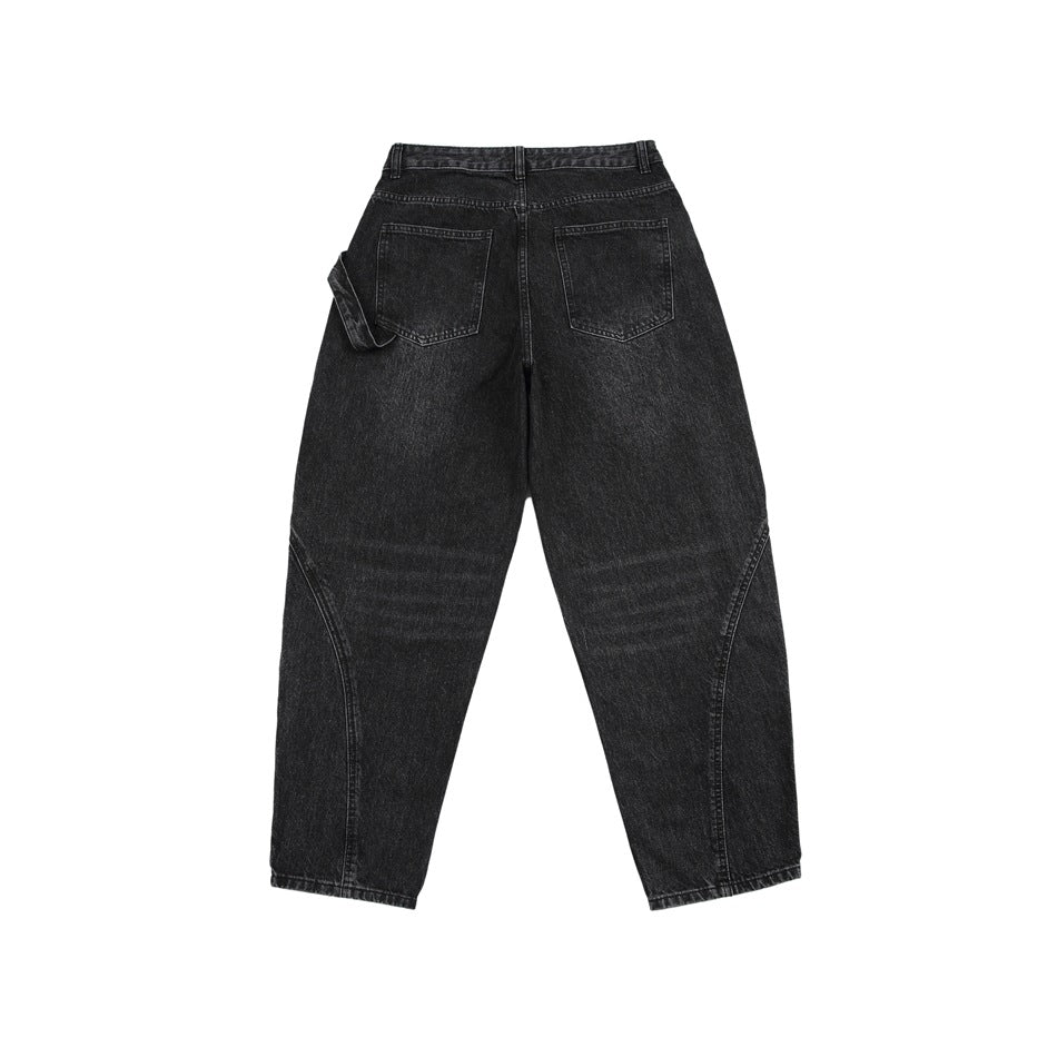 Back view of charcoal black jeans laid flat, with two rear pockets and curved seam details.