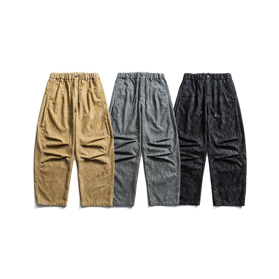 Three pairs of relaxed-fit pants shown from the front in tan, gray, and black.