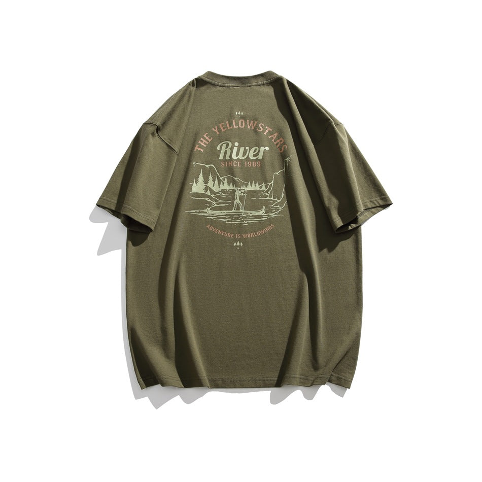 Back of an olive green T-shirt with a vintage Yellowstone River landscape graphic in cream and muted peach.