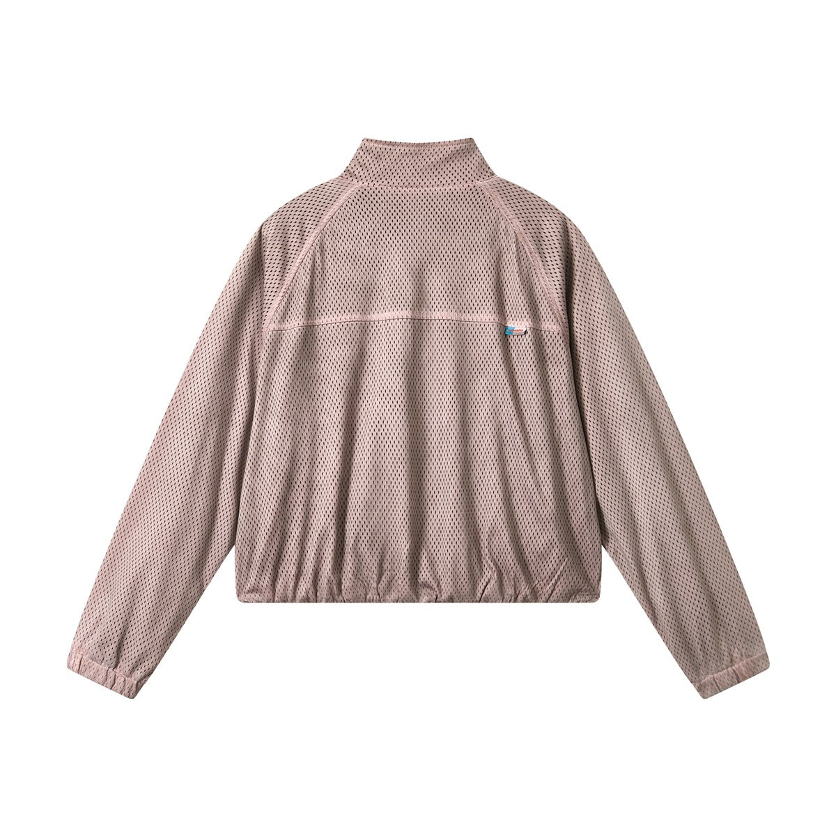 Back view of dusty pink perforated mesh jacket with upper back seam, small blue label and elastic hem