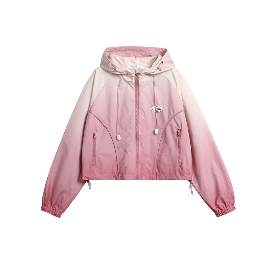 Front view of a cropped pink hooded jacket with a zip front, drawcords, and two zip pockets.