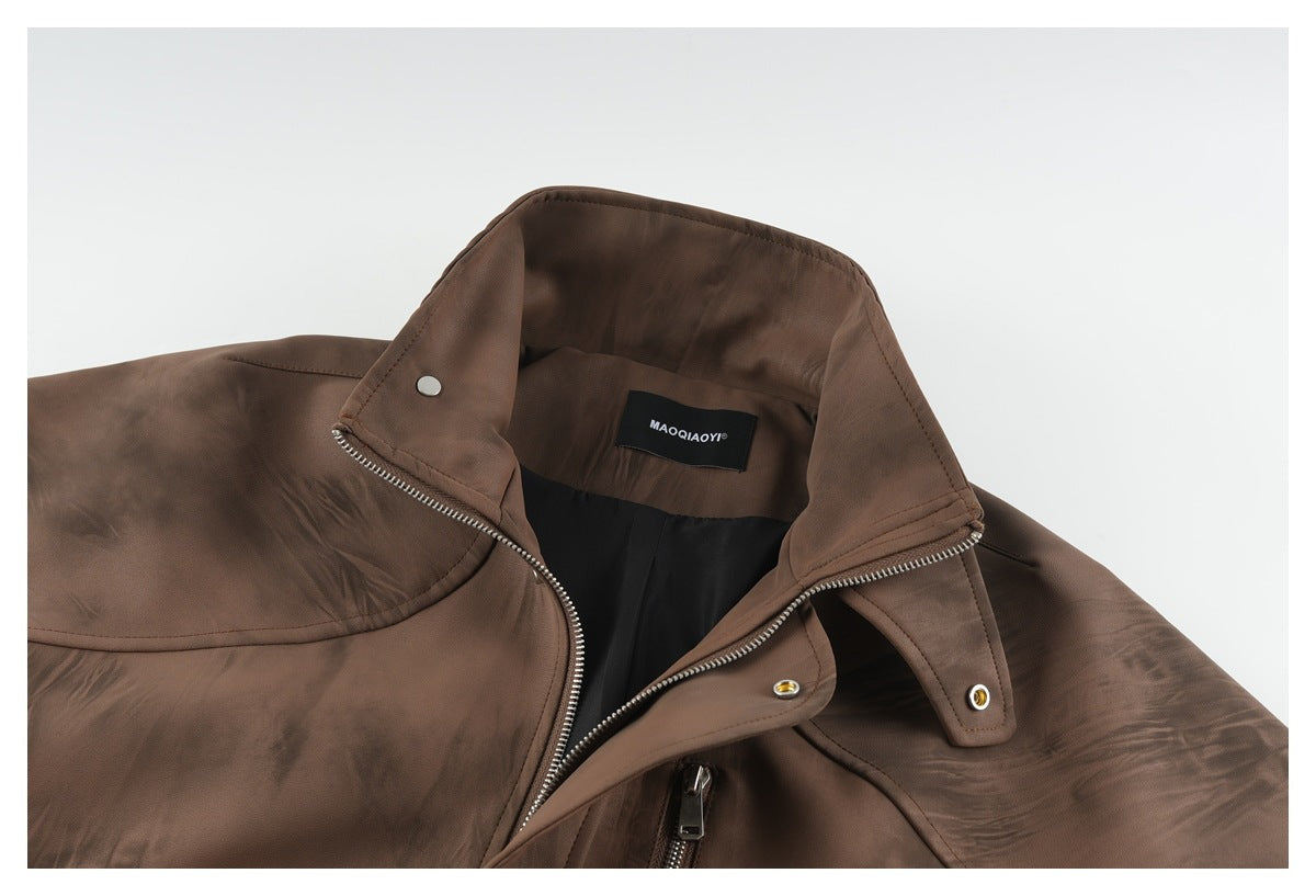 Brown jacket collar opened to show the black lining, zipper, snap fasteners, and sewn-in brand label.
